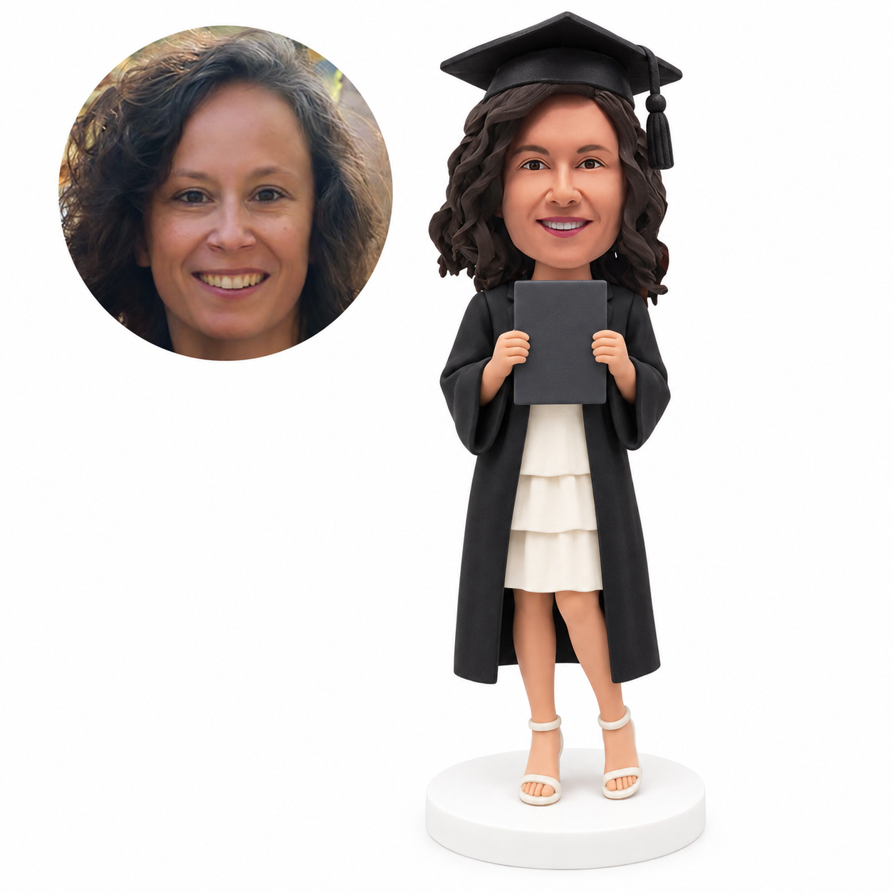 custom bobblehead figure female graduate in a tiered dress holding a folder at chest height - custom polymer clay bobblehead figure
