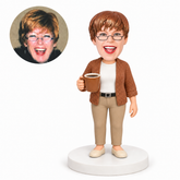 custom bobblehead figure woman in a knitted cardigan holding a coffee mug