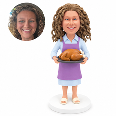 custom bobblehead figure woman in an apron holding a roast turkey on a tray