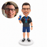 custom bobblehead figure athlete in a hydration vest holding a bottle