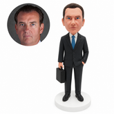 custom bobblehead figure businessman holding a briefcase with one hand in his pocket