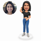 custom bobblehead figure woman in a crop top and jeans with one hand raised