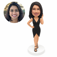 custom bobblehead figure woman in a V-neck wrap dress with a raised hand