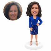 custom bobblehead figure woman in a cropped blue jacket and straight skirt
