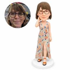 custom bobblehead figure woman in a button-front long dress with a raised hand