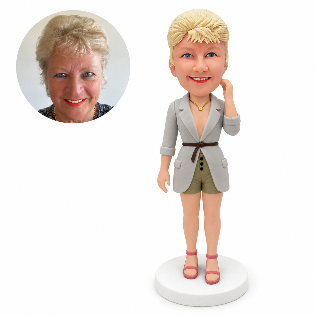 custom bobblehead figure woman in a belted long jacket and shorts with one hand beside her hair
