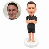 custom bobblehead figure man in a T-shirt and shorts with folded arms and bare feet