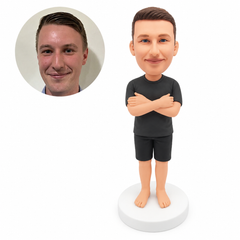 custom bobblehead figure man in a T-shirt and shorts with folded arms and bare feet