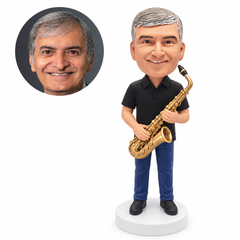 custom bobblehead figure man in a black polo shirt holding a saxophone diagonally
