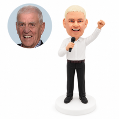 custom bobblehead figure singer in a white shirt holding a microphone with one arm raised