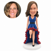 custom bobblehead figure woman in a ruffled high-low dress lifting one knee