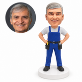 custom bobblehead figure worker in overalls with a tool belt and both hands on his hips
