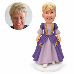 custom bobblehead figure woman in a layered gown holding the overskirt with both hands