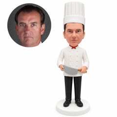 custom bobblehead figure chef holding a large curved cleaver