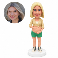 custom bobblehead figure pregnant woman in a tied-front blouse and shorts cradling her belly