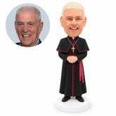 custom bobblehead figure bishop in a cassock and shoulder cape with hands clasped