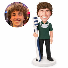 custom bobblehead figure dentist holding an oversized toothbrush