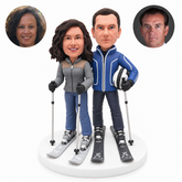 custom bobblehead figures skiing couple with three poles and a helmet