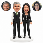 custom bobblehead figures formal couple in a waistcoat and trouser suit holding hands