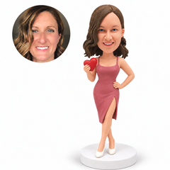 custom bobblehead figure woman in a slit midi dress holding a small heart