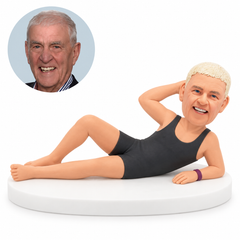 custom bobblehead figure man reclining in a one piece swimsuit
