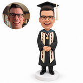 custom bobblehead figure male graduate with honor cords and a medal folding his hands