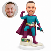 custom bobblehead figure handyman superhero with a drill and a tool belt resting one foot on a toolbox