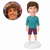 custom bobblehead figure man in a three-quarter-sleeve sweatshirt and shorts with his arms at his sides
