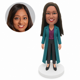 custom bobblehead figure woman in an ankle-length trench coat and trousers with both arms down