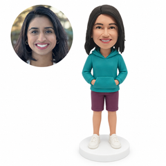 custom bobblehead figure woman in a pullover hoodie and shorts with both hands in the front pocket