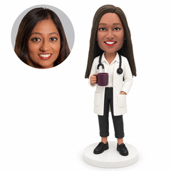 custom bobblehead figure female doctor holding a mug with a hand in her coat pocket