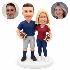 custom bobblehead figures football couple with arm around shoulder each holding a ball; original Bobblefigurine polymer clay heads with matching circular human portraits.