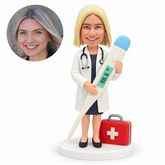 custom bobblehead figure female doctor holding giant thermometer with medical bag; original Bobblefigurine polymer clay head and corresponding circular real portrait.