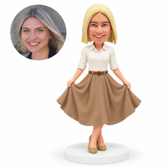 custom bobblehead figure woman holding both sides of a flared skirt