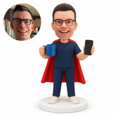 custom bobblehead figure male hero holding a mug and a smartphone