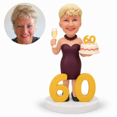 custom bobblehead figure woman celebrating her 60th birthday with a cake, champagne flute and large number display