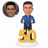 custom bobblehead figure man celebrating his 50th birthday with both thumbs up and a large number display