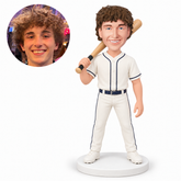 custom bobblehead figure male baseball player resting a bat over one shoulder with his other arm down
