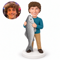 custom bobblehead figure man holding a huge upright fish with both hands