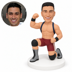 custom bobblehead figure male wrestler kneeling on one knee with one fist raised and his other fist at his waist