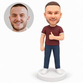 custom bobblehead figure man in a T-shirt and jeans giving a thumbs up across his chest with his other arm down