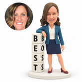 custom bobblehead figure businesswoman standing with feet apart and one forearm resting on a four-block best boss tower