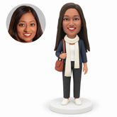 custom bobblehead figure woman in a jacket and long scarf holding a shoulder bag strap MGA-AC1265