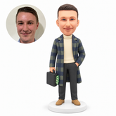 MGA-AC1291 custom bobblehead figure man in a long coat carrying a money case with his other hand in his trouser pocket