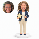 custom bobblehead figure businesswoman holding a large star-shaped award with her other hand near her jacket