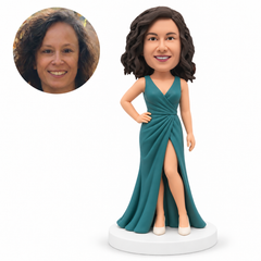 custom bobblehead figure woman in a floor-length wrap gown with one hand on her hip and the other arm down