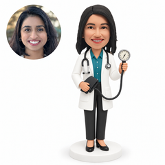 Custom bobblehead figure female doctor holding a blood pressure gauge and cuff
