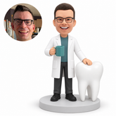custom bobblehead figure male dentist holding coffee beside a giant tooth