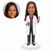 custom bobblehead figure female pharmacist holding a medicine bottle and capsule