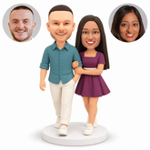 custom bobblehead figures couple taking a walk with woman in a short dress linking the man's arm with both hands